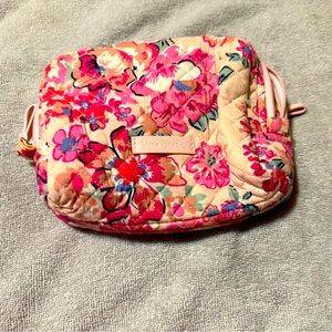 Plastic lined cosmetic bag in a pretty pink floral pattern!